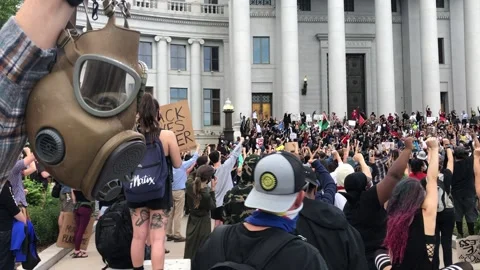 George Floyd Death Protest - Denver, Colorado - Protester Holds A Gas Mask 動画素材 131353541