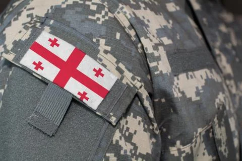 Georgia army uniform patch flag on soldiers arm. Military Concept Stock Illustration