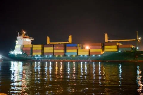 GEORGIA, BATUMI - NOVEMBER 24/2014: Huge tanker is moored at night in the sea Stock Photos