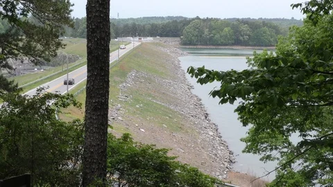 Georgia, Buford Dam Park, An upper view of Buford Dam with cars as the camera Stock Footage 89733189