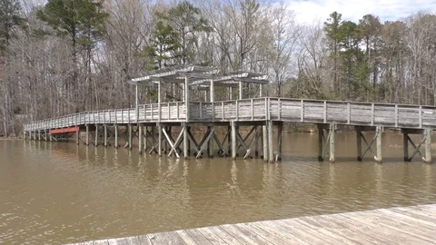 Georgia, Cauble Park, The front view of the wooden bridge that crosses the co Video stock 87832338