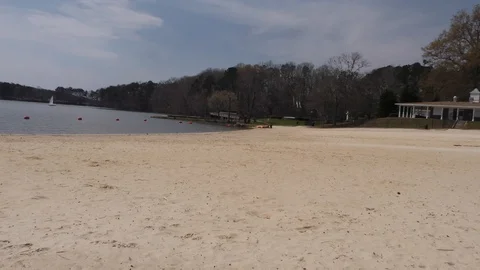 Georgia, Cauble Park, A view from the Lake Acworth beach, the lake and a sail Stock Footage 87809133