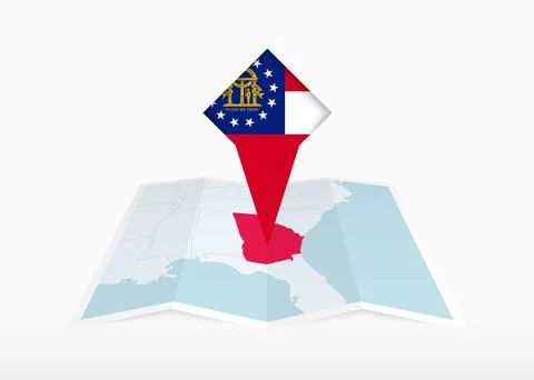 Georgia is depicted on a folded paper map and pinned location marker with f.. Stock Illustration