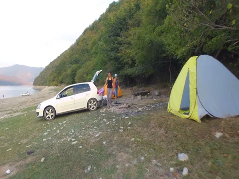 GEORGIA, SEPTEMBER 19, 2017: Two fashionable female tourists on a car with a  Video stock 83332638