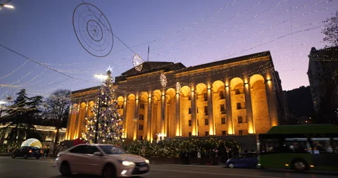 Georgia, Tbilisi. A Christmas tree and festive lights in front of the Parliament Stock Footage 229951253