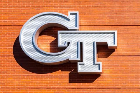 Georgia Tech logo on the side of a brick building on campus. Stock Photos