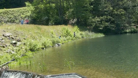 Georgia Vogel Park Springtime  A view of people fishing on Lake Trahlyta whi Video stock 153758720