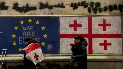 Georgian flag and EU, wall with text We are Europe, cross Stock Footage 300651994