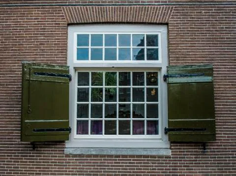 Georgian style window frame on brick house in Amsterdam Stock Photos
