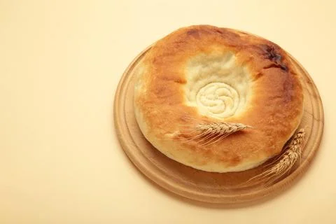 Georgian traditional bread flatbread on beige background. Stock Photos