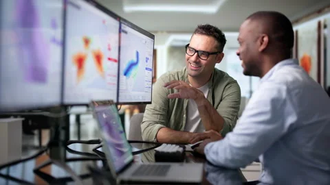 Geospatial Analyst And Colleague Mapping Flood Risk Stock Footage 345850574