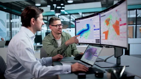 Geospatial Analyst Reviews Flood Risk Map Using Laptop Stock Footage 346327024