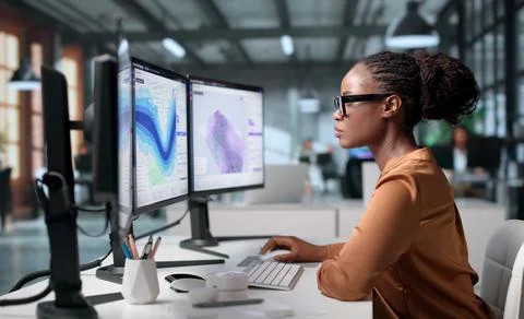 Geospatial Analyst Uses Computer Software To Study Flood Risk Maps Carefully. Stock Photos