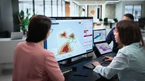 Geospatial Analysts Using Software To Map Flood Risk Stock Footage 347303638