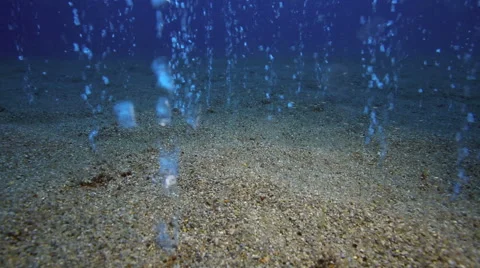 Geothermal bubbles rising out of ocean floor Stock Footage