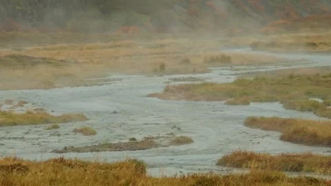Geothermal landscape with steam rising from a river in Iceland. Stock-Footage 320515904