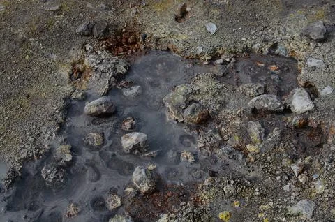 Geothermal Mud Pool Surrounded By Sulfur Deposits. Stock Photos