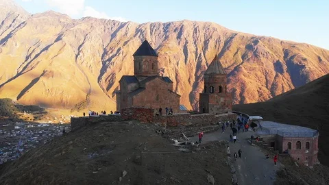 Gergeti Trinity Church in the Shadow of the Mountains Видео 101762472