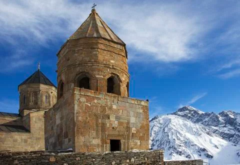 Gergeti Trinity Church in Tsminda Sameba, Kazbegi, Georgia. Epic religious and 写真素材