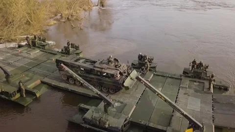 German Army Leopard tank driving on amphibious rig during river crossing Stock Footage 266976887