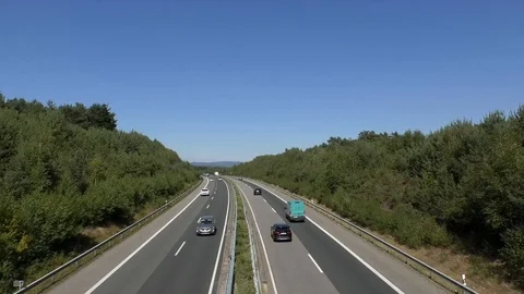 German autobahn seen from bridge, freeway, highway, vehicle, cars, trucks, trees Stock Footage 115134623
