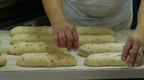 German baker cut bread dough Stock Footage 57136615