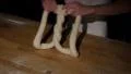 german baker kneading huge pretzel spotlight 4k or 4k+ Resolution