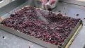 german baker sprinkle sugar over a fruitcake 4k or 4k+ Resolution
