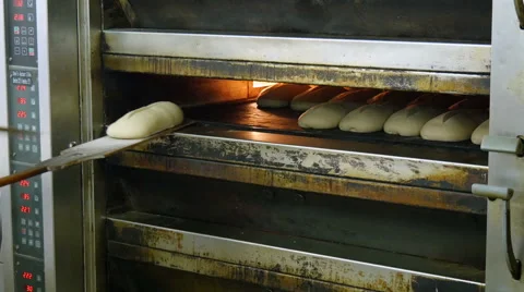 German bakery fill up an oven with bread 4k 11696 Stock Footage 55631273