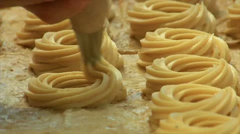 German bakery squirt dough on sheet Stock Footage 12347313