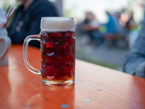 German beer mug sitting on table at outdoor event Stock Photos