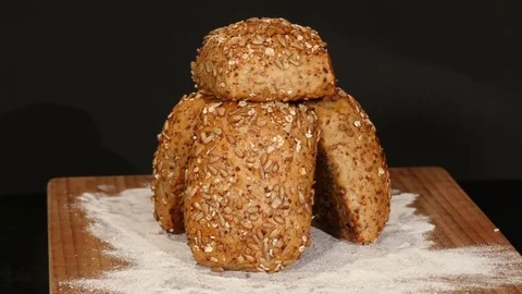 German bread grains roll bun on turntable 2 shots Stock Footage 81511096