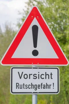 German caution warning sign for slippery road Stock Photos
