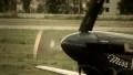German combat plane with propeller and swastika steers airport HD Footage