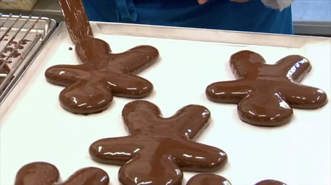 German confectioner gingerbread man put on plate 10785 Stock Footage 12623435