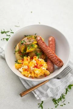 German egg breakfast with sausages and potato Stock Photos