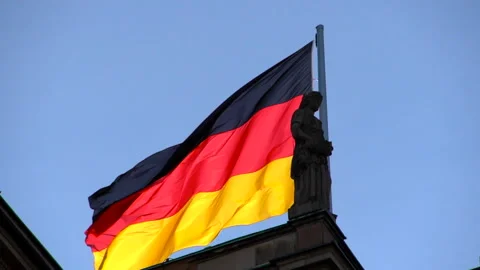 German flag with behind a stone statue Stock Footage 168222368