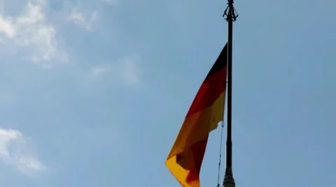 German flag with fabric structure against a blue sky Stock Footage 41721143