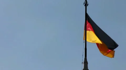 German flag with fabric structure against a blue sky Stock Footage 41721154