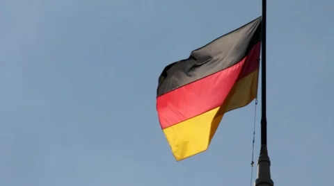 German flag with fabric structure against a blue sky Stock Footage 41721379