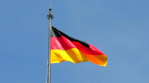 German flag with fabric structure against a blue sky Stock Footage 41721484