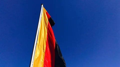 German flag in front of blue sky with copy space Stock Footage 94202970