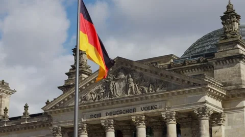 German Flag in Front of the Reichstag Building in Berlin Stock Footage 279396295