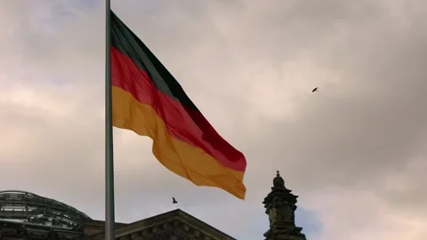 German flag on the German Parliament on a cloudy day in Berlin Stock-Footage 322942452