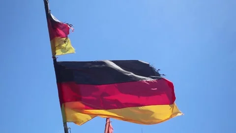 A German flag torn by storm winds Stock-Footage 345704027