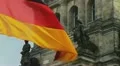 German flag waving and detail of Reichstag building in Berlin HD Footage