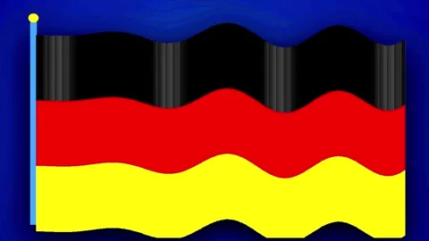 German flag waving in wind against blue sky with subtle ripple effect cinem.. Stock Footage 345320930