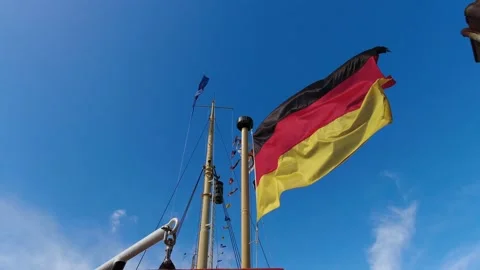 German flag waving in the wind on a pole Video stock 238985696