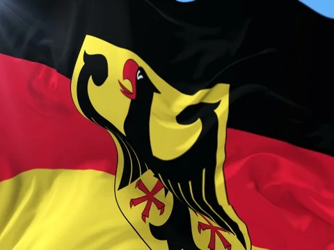German flag waving at wind in slow with blue sky, loop Stock Footage