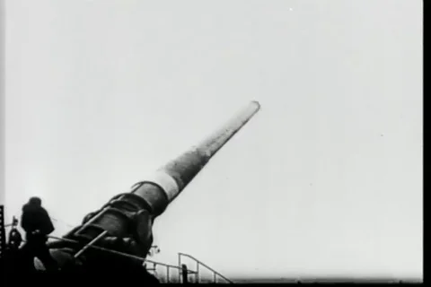 German gun crew load shells into huge gun and fire -1944 Stock Footage 93846497